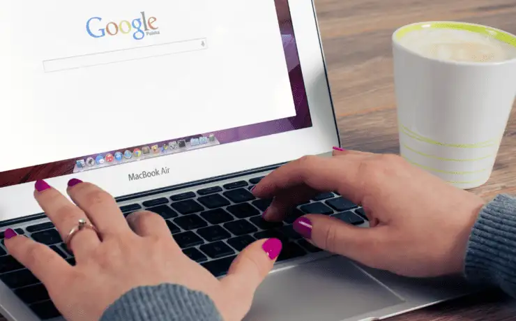 Advanced Google Features for Superior Digital Marketing 6 Laptop open on google with hands typing on the keyboard