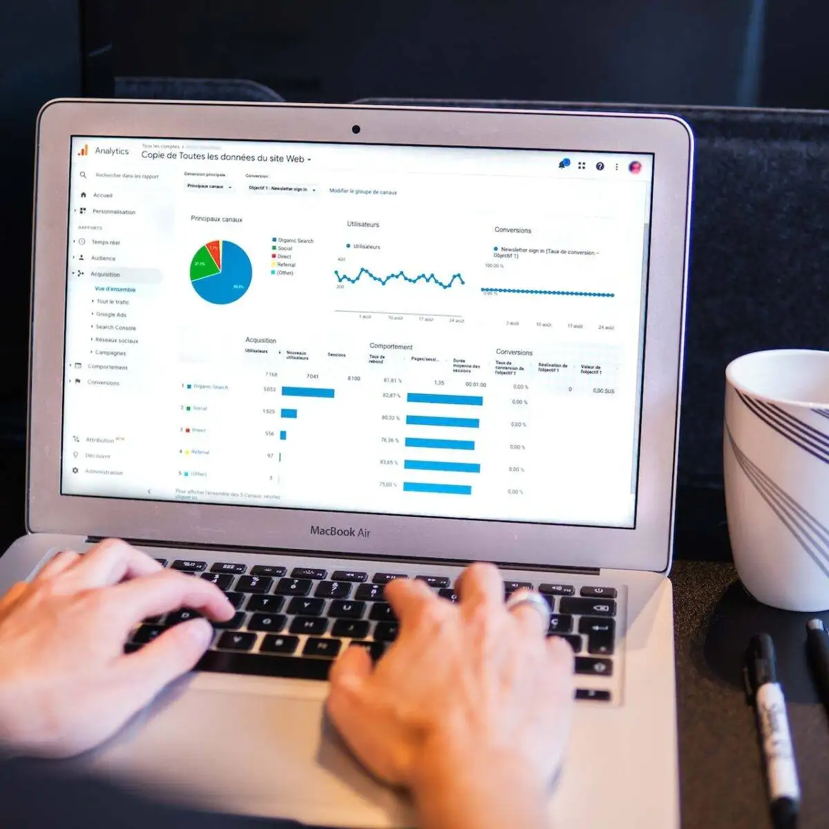 Revolutionising Digital Marketing: The Future of Data Analytics 2 Woman working on a laptop with data analytics for digital marketing.