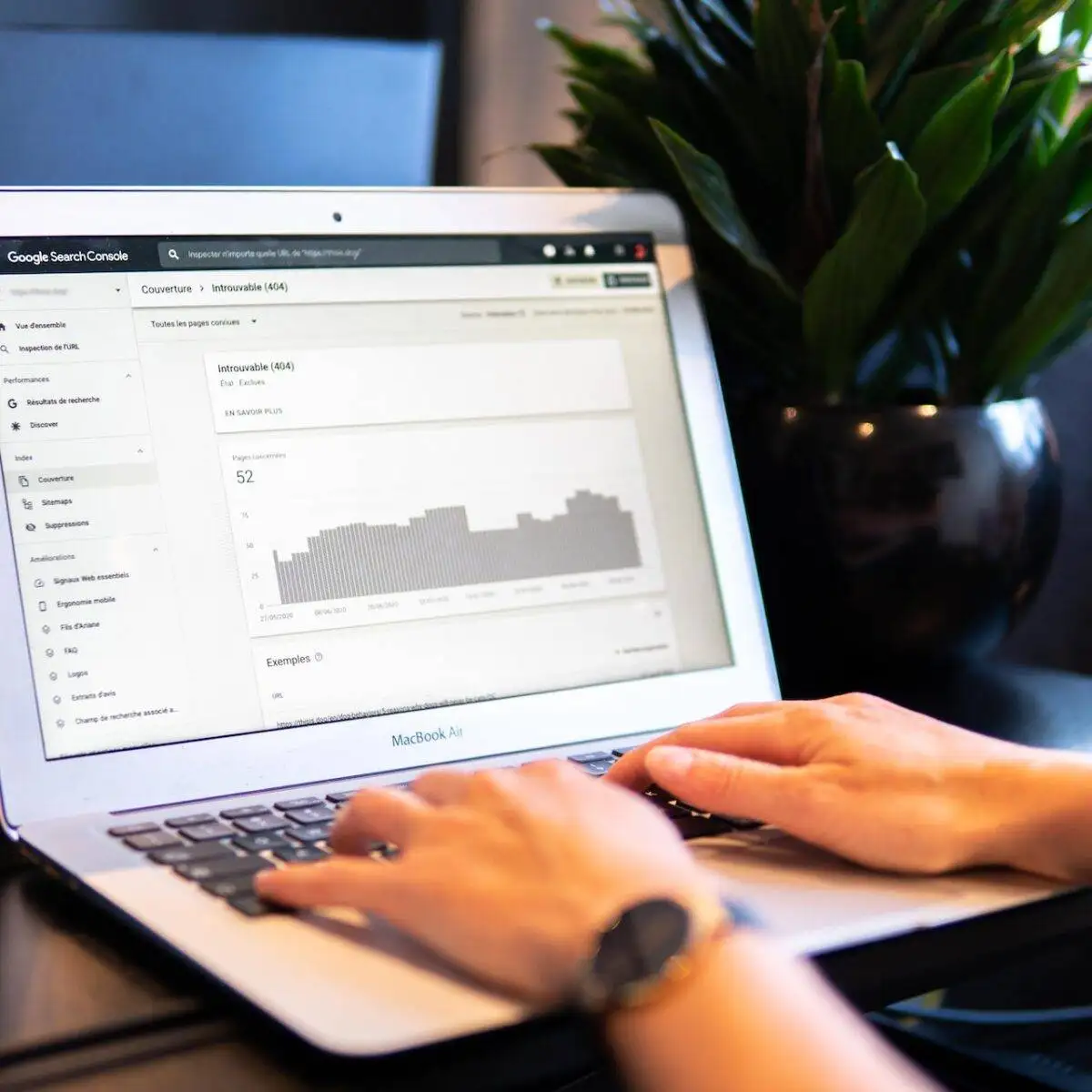 SEO Best Practices: Insights from a 10,000 Keyword Analysis 2 Hands on a laptop with an seo or analytics page open