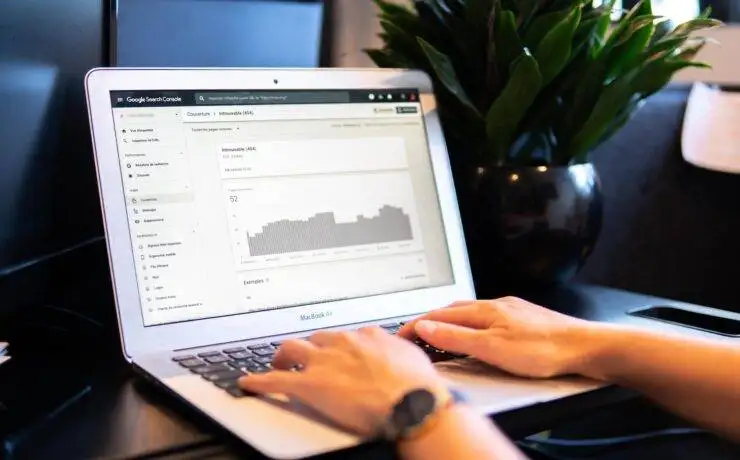 SEO Best Practices: Insights from a 10,000 Keyword Analysis 3 Hands on a laptop with an seo or analytics page open