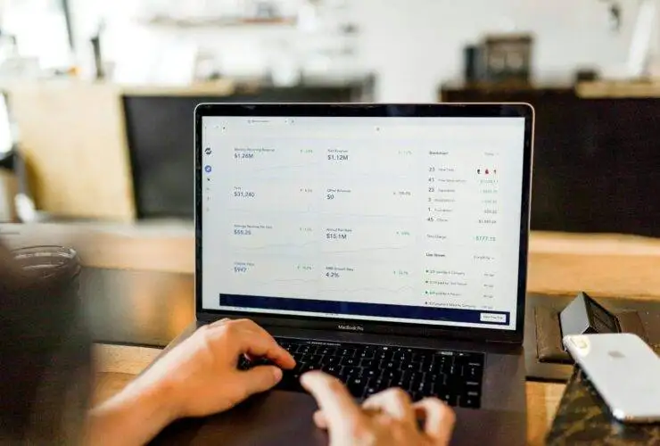 A man with his laptop screen viewing google ads analytics