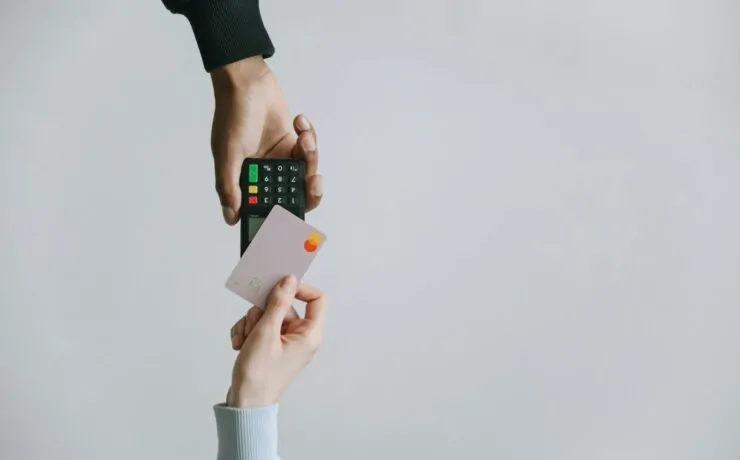 How to Streamline Your Ecommerce Stores Checkout Process 23 Close-up of a man and woman holding hands while sitting together, creating a warm and intimate atmosphere. Ideal for conveying a sense of connection, trust, and support in the checkout process of an ecommerce store.