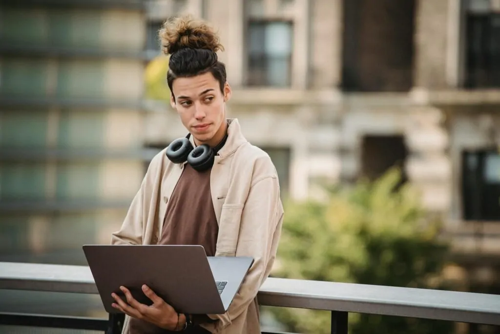a man holding a laptop looking for an SEO company for a small business