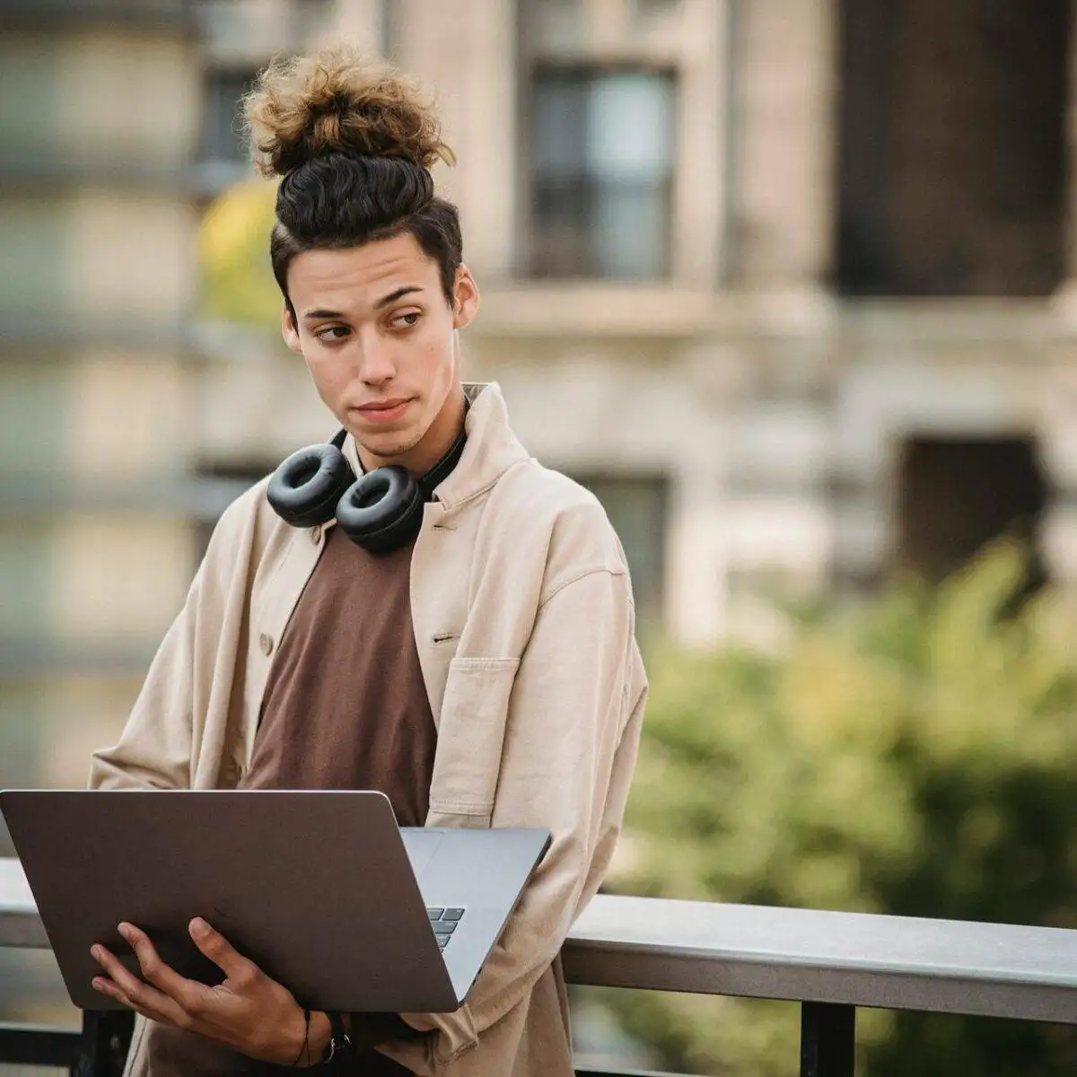 Finding the Right SEO Company for Small Business: Key Considerations 2 a man holding a laptop looking for an SEO company for a small business