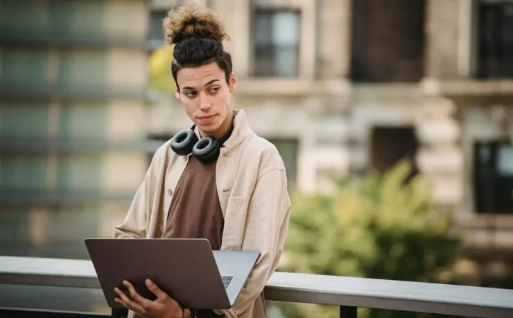 Finding the Right SEO Company for Small Business: Key Considerations 3 a man holding a laptop looking for an SEO company for a small business
