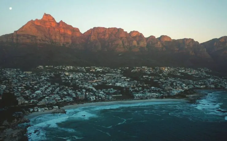 How To Market Your Business Online In South Africa In 2024 12 a city on a beach with mountains in the background in South Africa