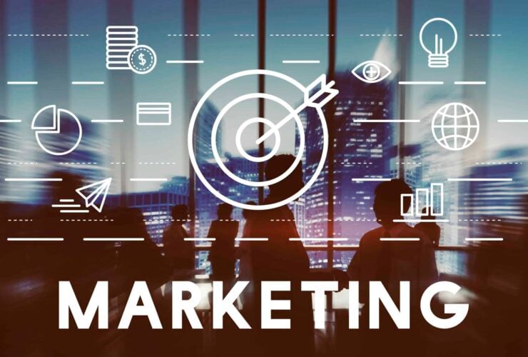Marketing concept blending traditional and digital marketing strategies with symbols of analytics, target, and global reach.